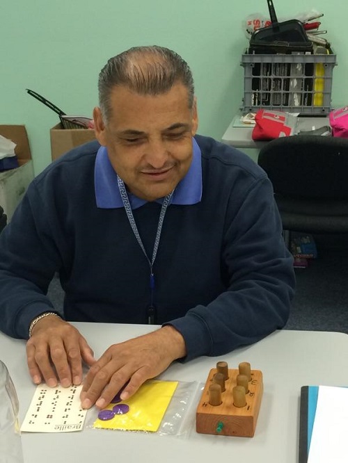 Ciro playing Loteria using Braille